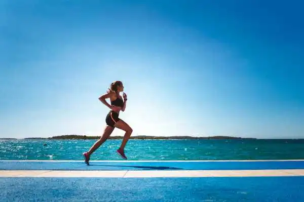Woman running showing strong leg muscle Sunninghill
